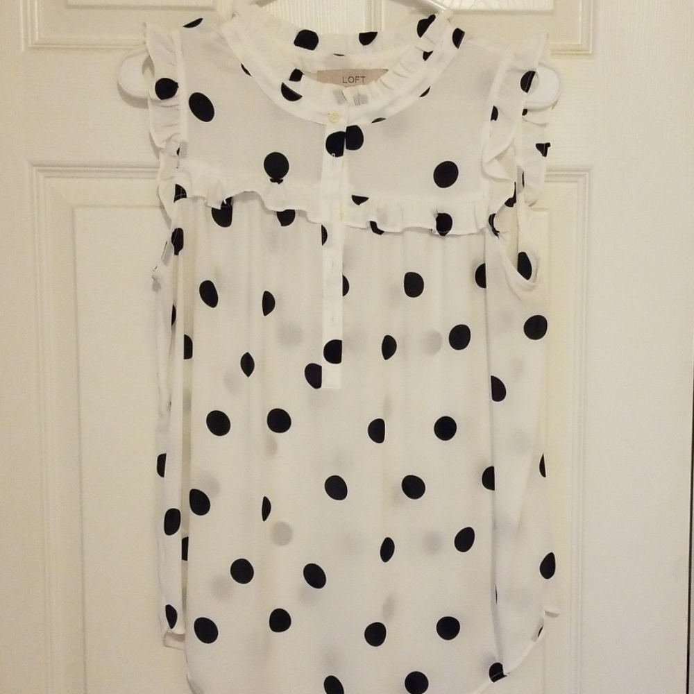 Sleeveless polka dot top with ruffles
